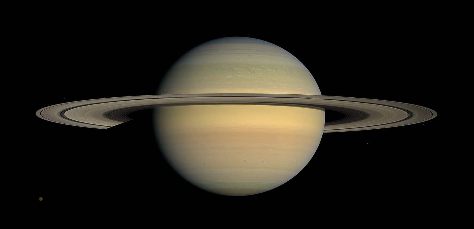 Saturn at equinox — the rings edge-on, casting a line of shadow across the planet.